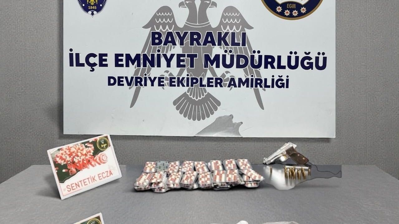 Bayraklı'da çamaşır makinesinde uyuşturucu ve ruhsatsız silah ele geçirildi