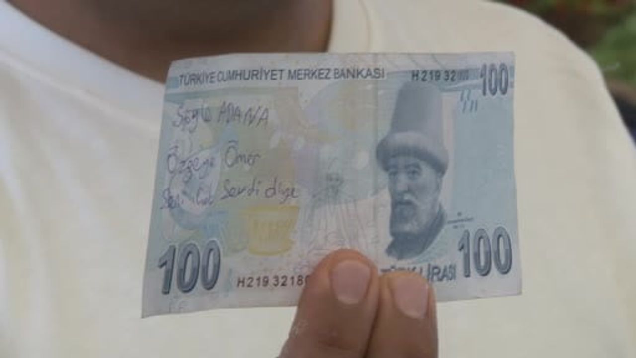 Adana'da yazılı banknotla alışveriş yapan kişiye pazarcıdan çağrı