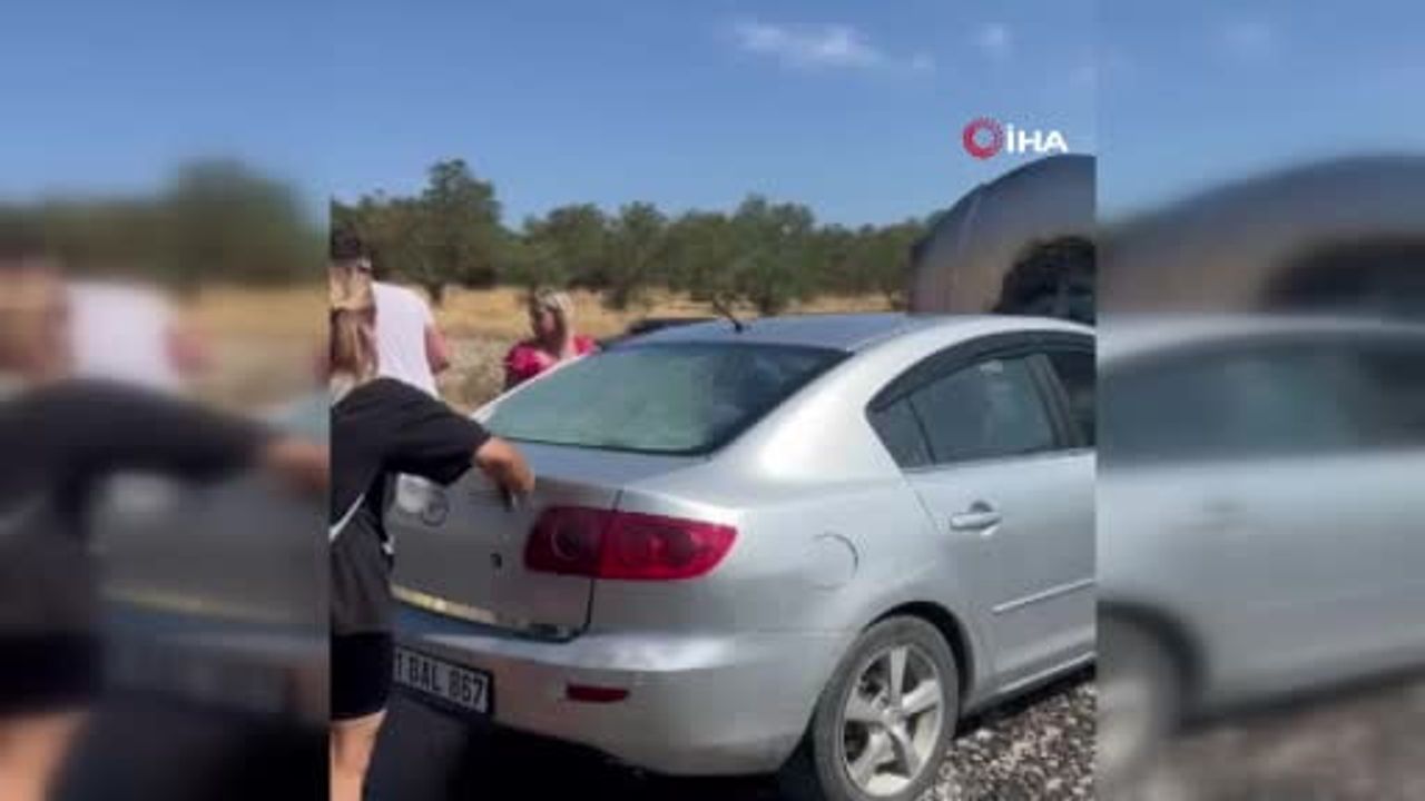 Ayvalık'ta alev alan otomobilin imdadına beton mikseri yetişti
