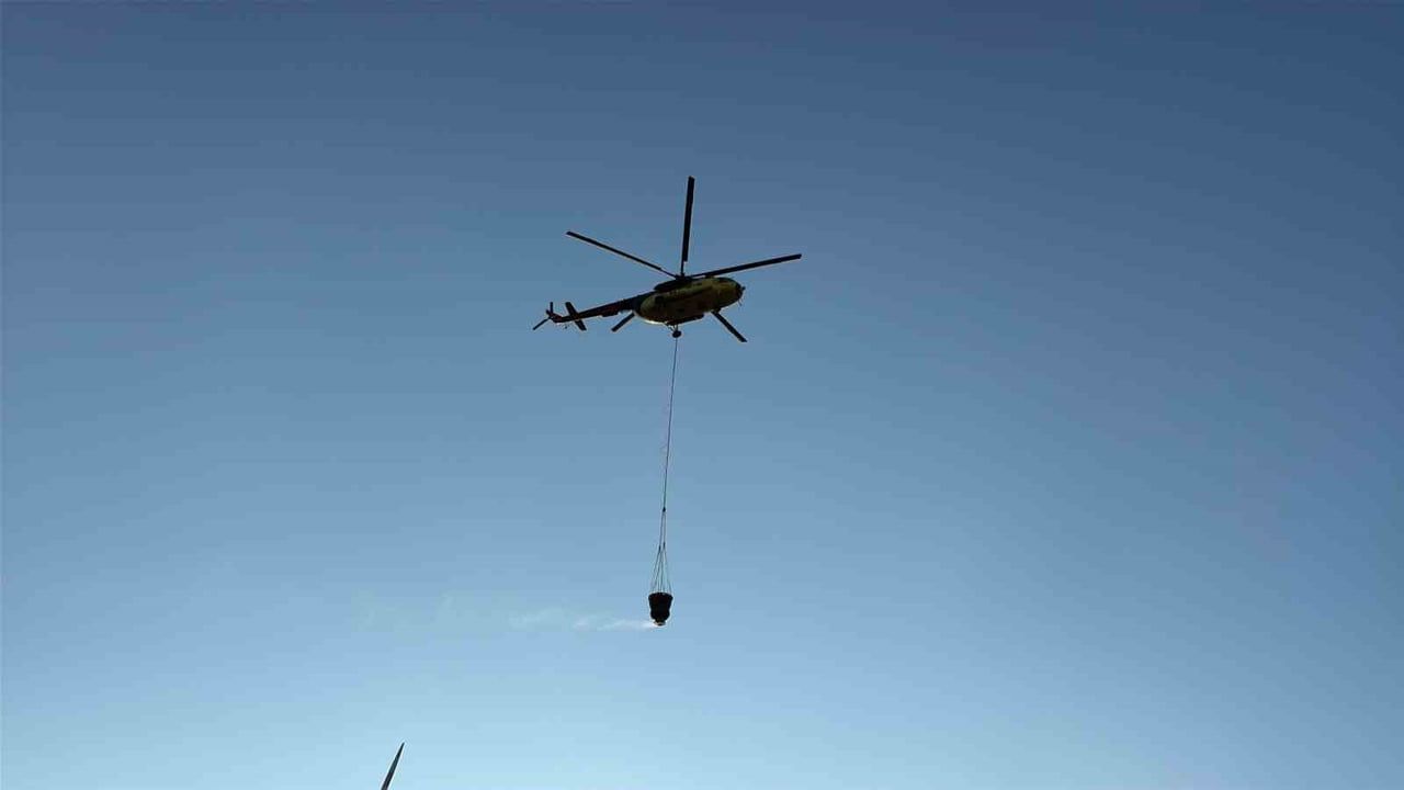 Bayramiç'te 9 uçak ve 8 helikopterle söndürülen orman yangını kontrol altına alındı