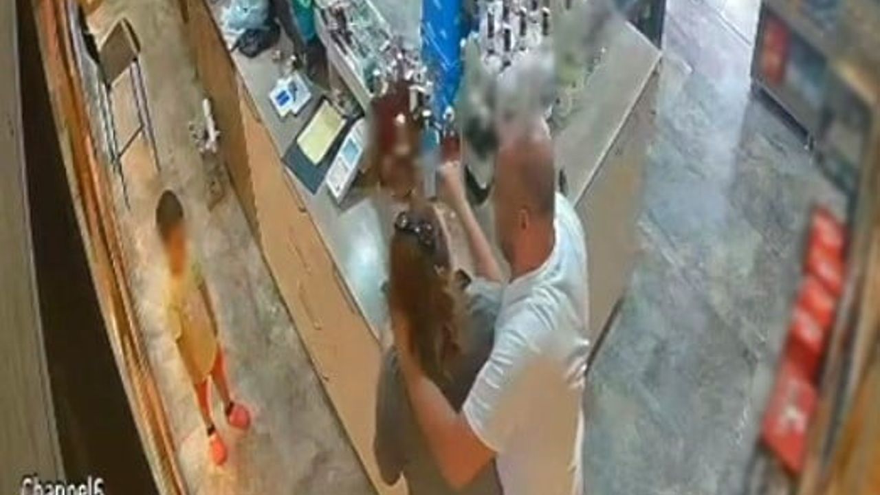 Çiğli'de tekel bayiinde çocuğun gözü önünde şiddet anı kamerada