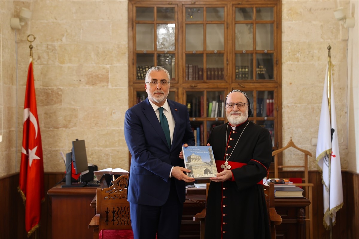 Çalışma ve Sosyal Güvenlik Bakanı Vedat Işıkhan (solda), Mardin'de Deyrulzafaran Manastırı'na...