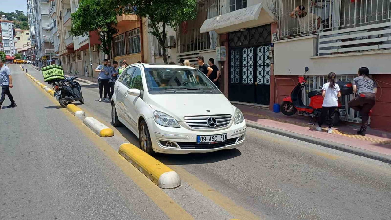 AYDIN'IN EFELER İLÇESİNDE KARŞI ŞERİDE GEÇEN OTOMOBİL İLE MOTOSİKLETİN ÇARPIŞMASI SONUCU MEYDANA...