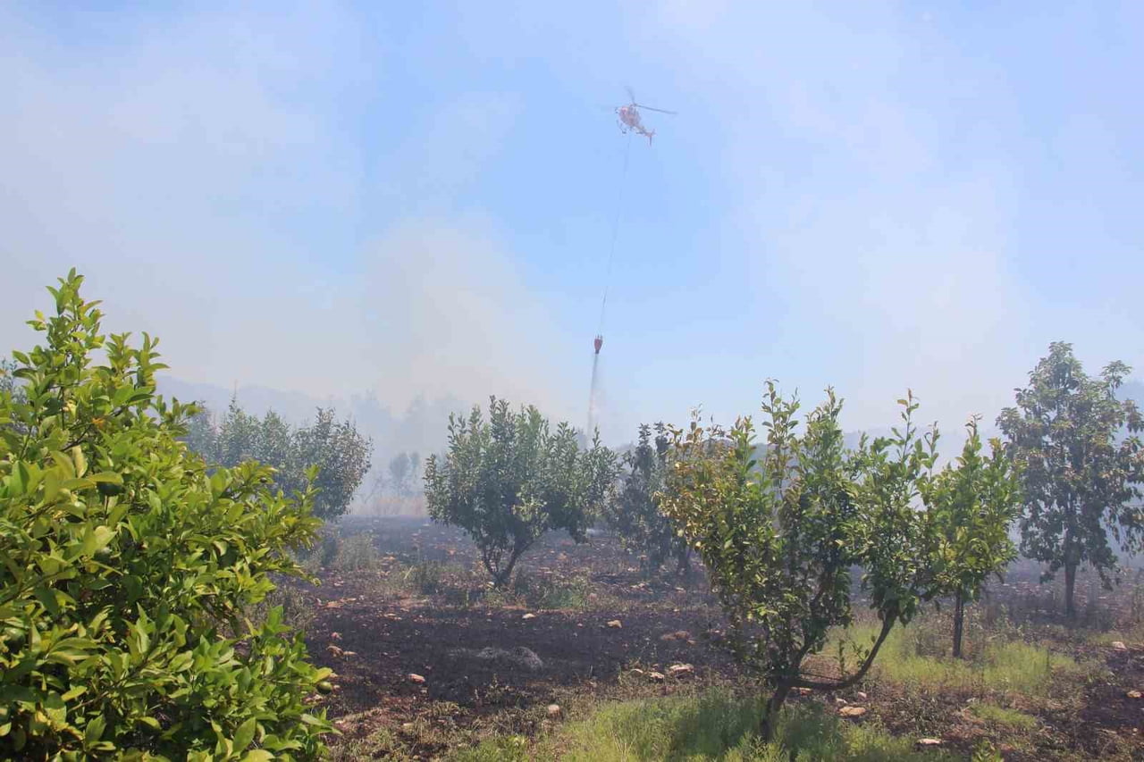 ANTALYA’NIN KUMLUCA İLÇESİNE BAĞLI GÜZÖREN MAHALLESİ'NDE OTLUK VE MAKİLİK ALANDA YANGIN ÇIKTI....